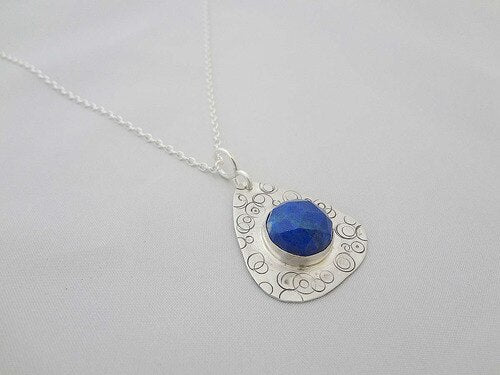 Silver pendant with lapis