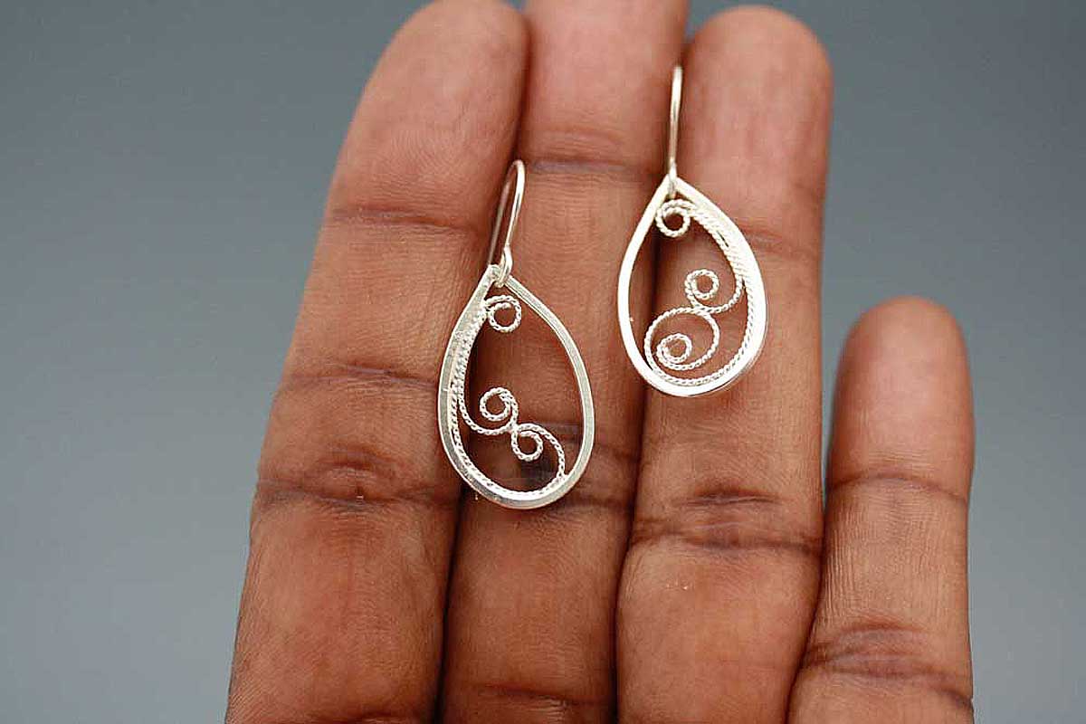 Teardrop filigree dangle earrings.