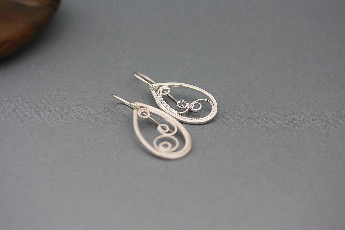 Teardrop filigree dangle earrings.