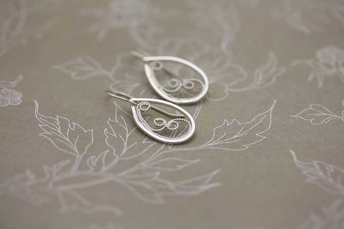 Teardrop filigree dangle earrings.