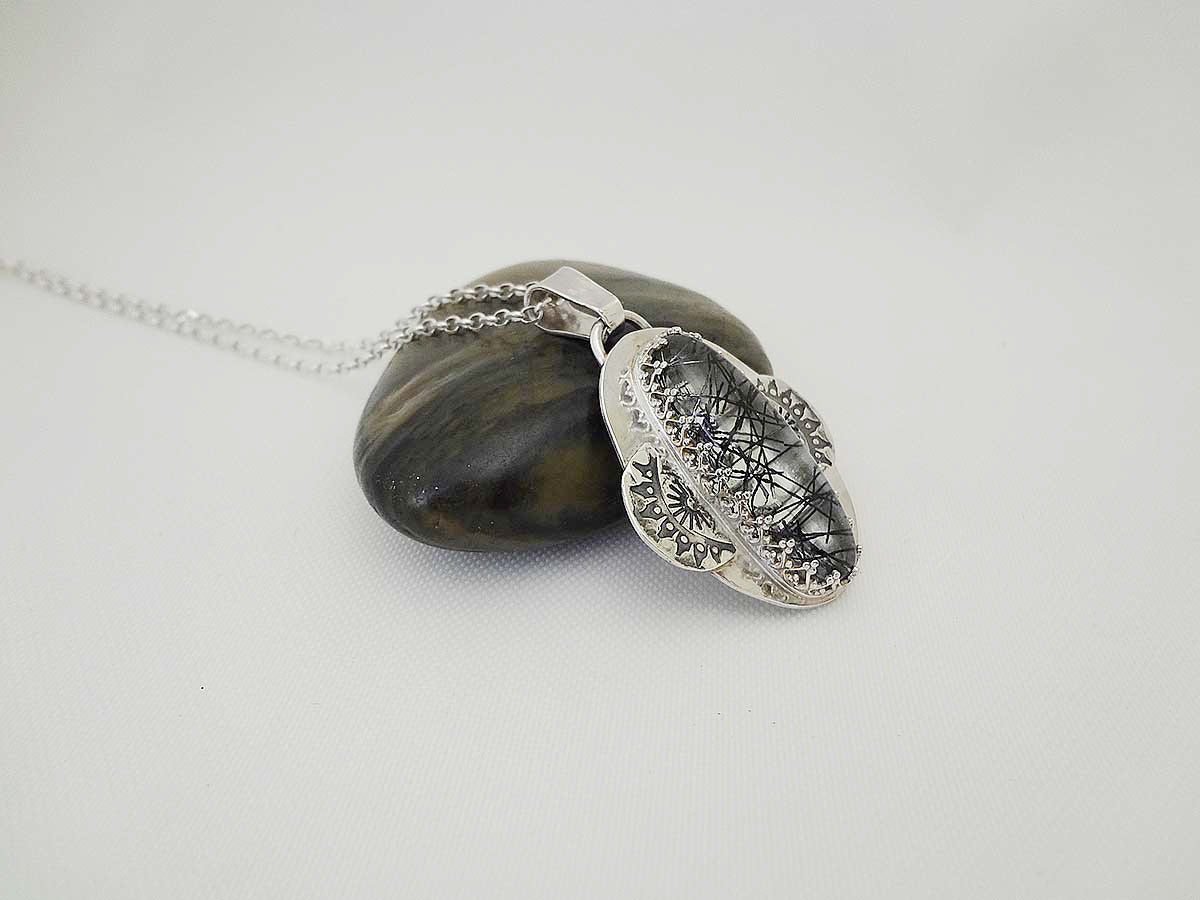 Coura Rutilated quartz and silver necklace pendant